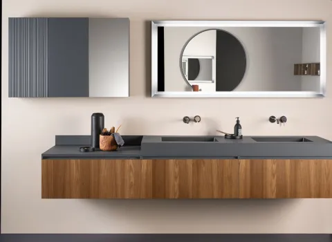 Modernes Badezimmer von Stocco mit schwebendem Doppelwaschtisch in Holzoptik, dunkler Aufsatzplatte und großem Spiegel.